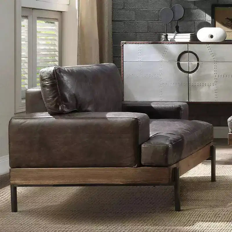 Poltrona di design in pelle marrone invecchiata